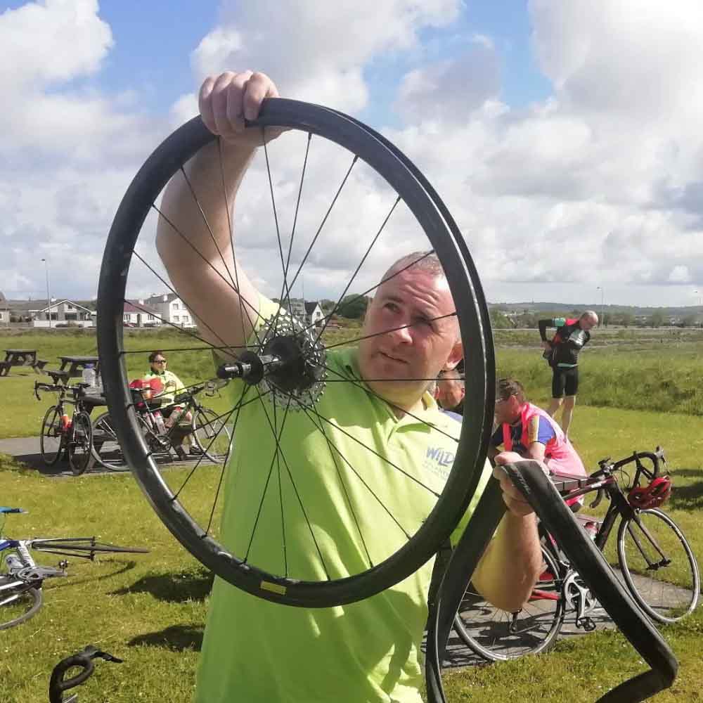 A man repairs the cycle ring for cycling in the MizMal cycling route