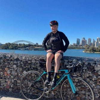 Cycling in Sydney with view of Harbour Bridge