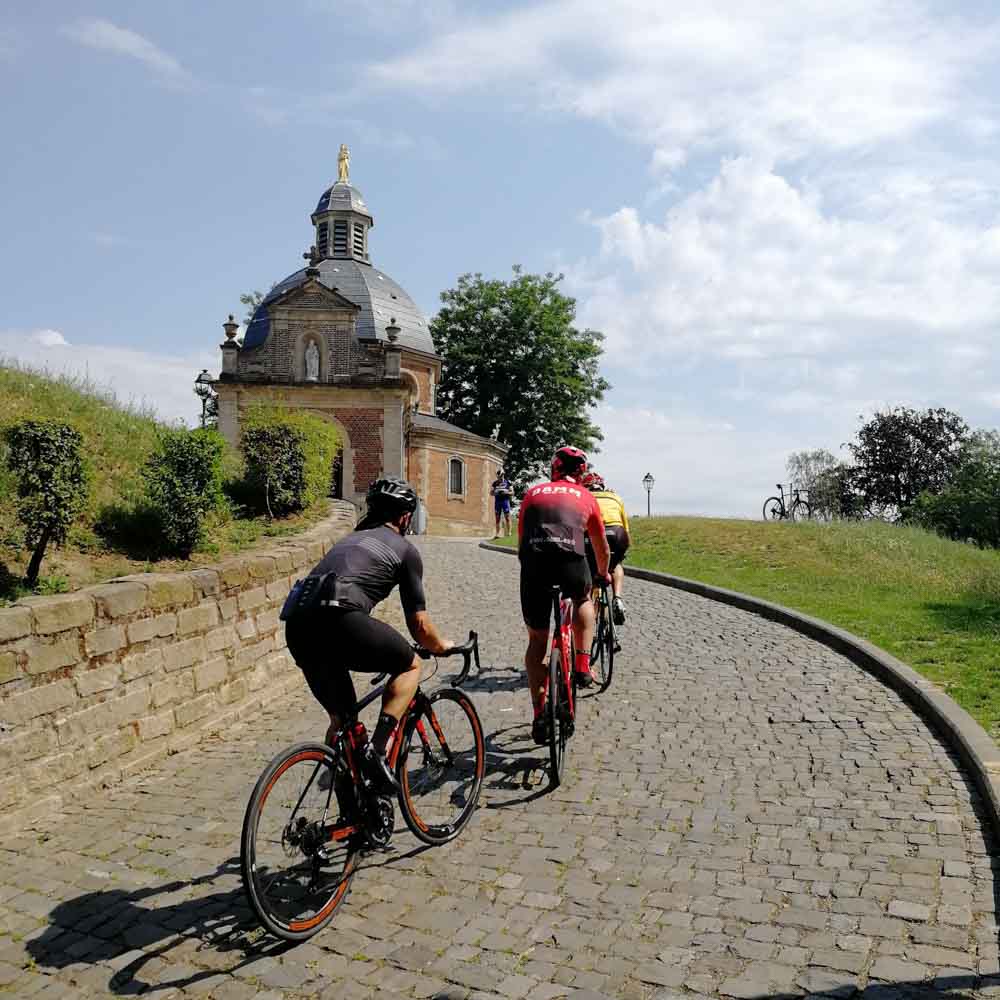Some cyclists enjoy the beauty of ancient installations on bike tour in belgium