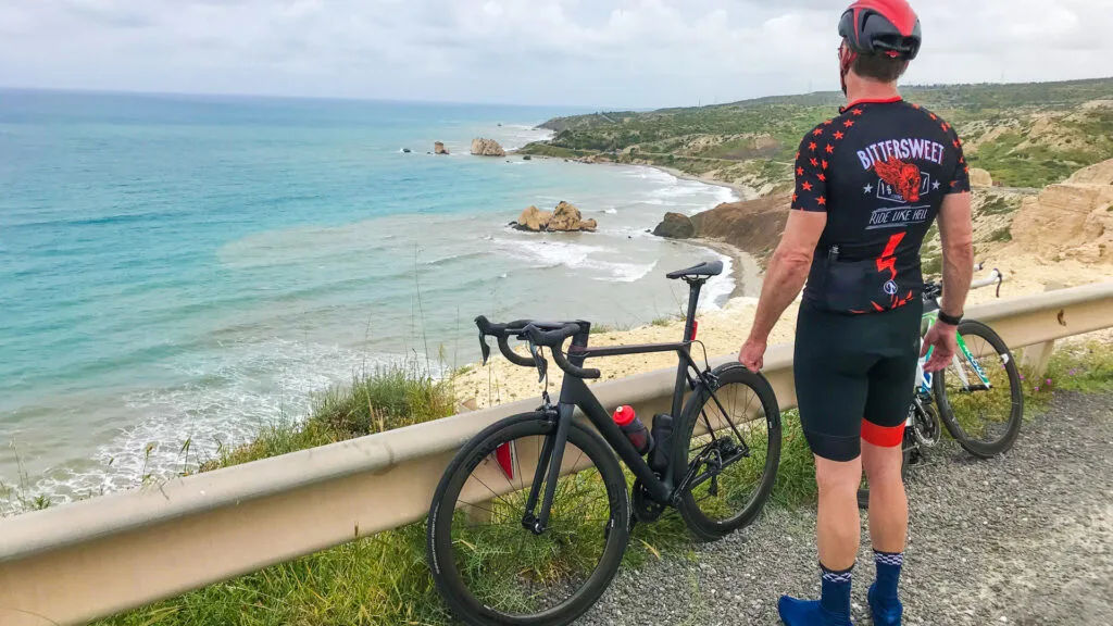 A cyclist overlooking the beautiful coastline of Cyprus