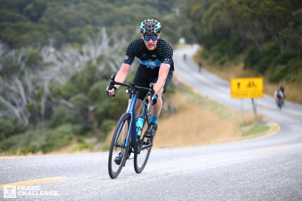 A cyclist cycling on the mountain sloping road of peaks challenge Australia