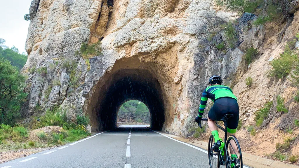 A cyclist approahcing a tunnel before Falset in the Costa Daurada region of Spain