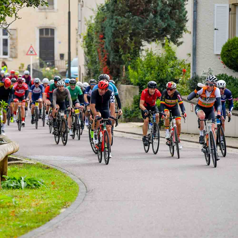 Cyclists are cycling on the roads at noon gran fondo Luxembourg