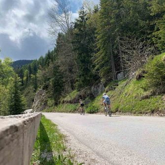 Cyclists ride bicycles on Slovenian Alps cycling holidays