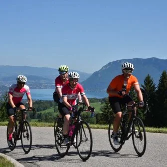 Four cyclists of cycle coaching cycling on the road