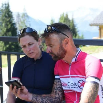 Two cyclists are receiving training from cycling coaches online