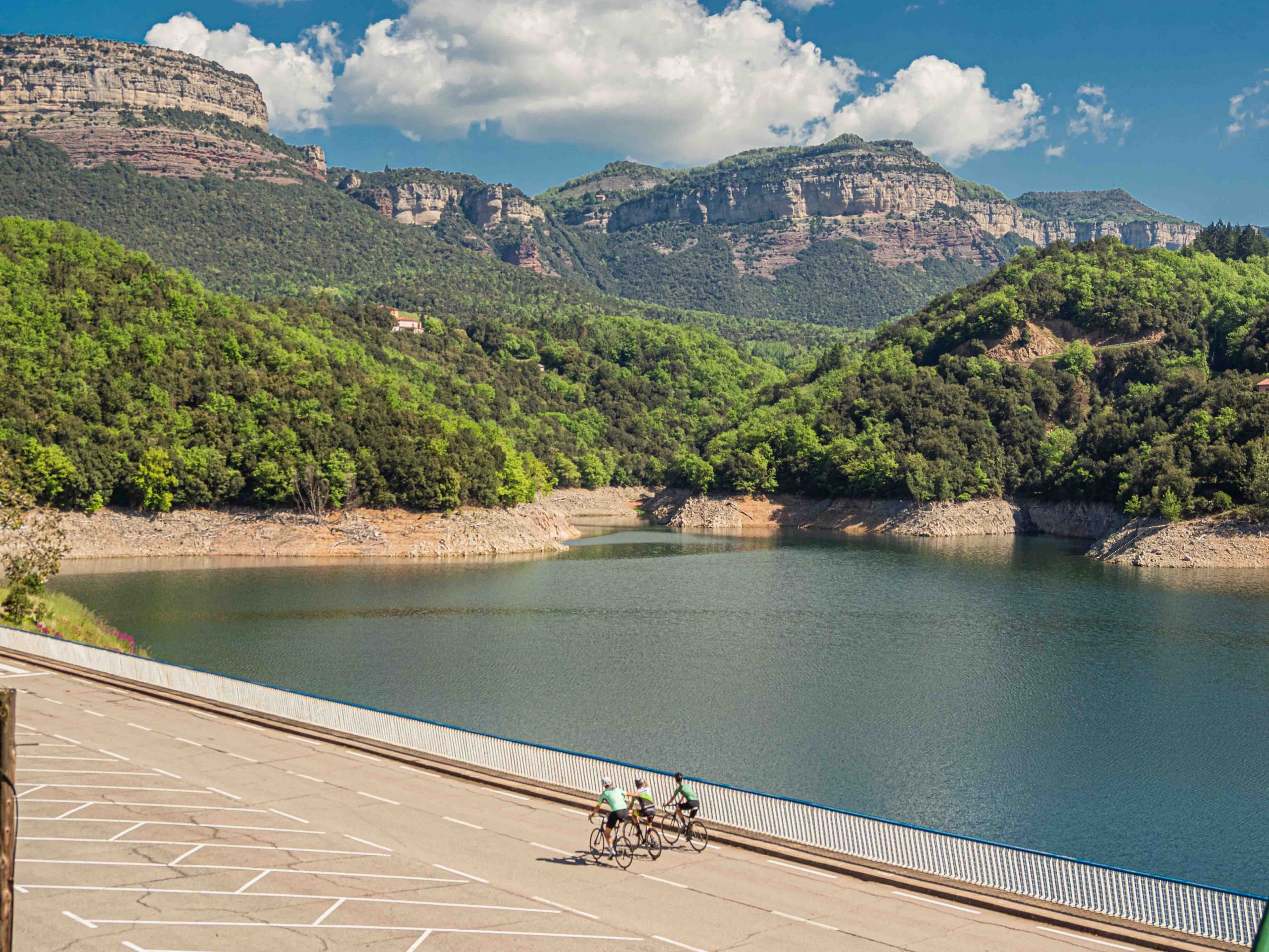 Cyclists near a lake in the Osona region near Barcelona, Spain