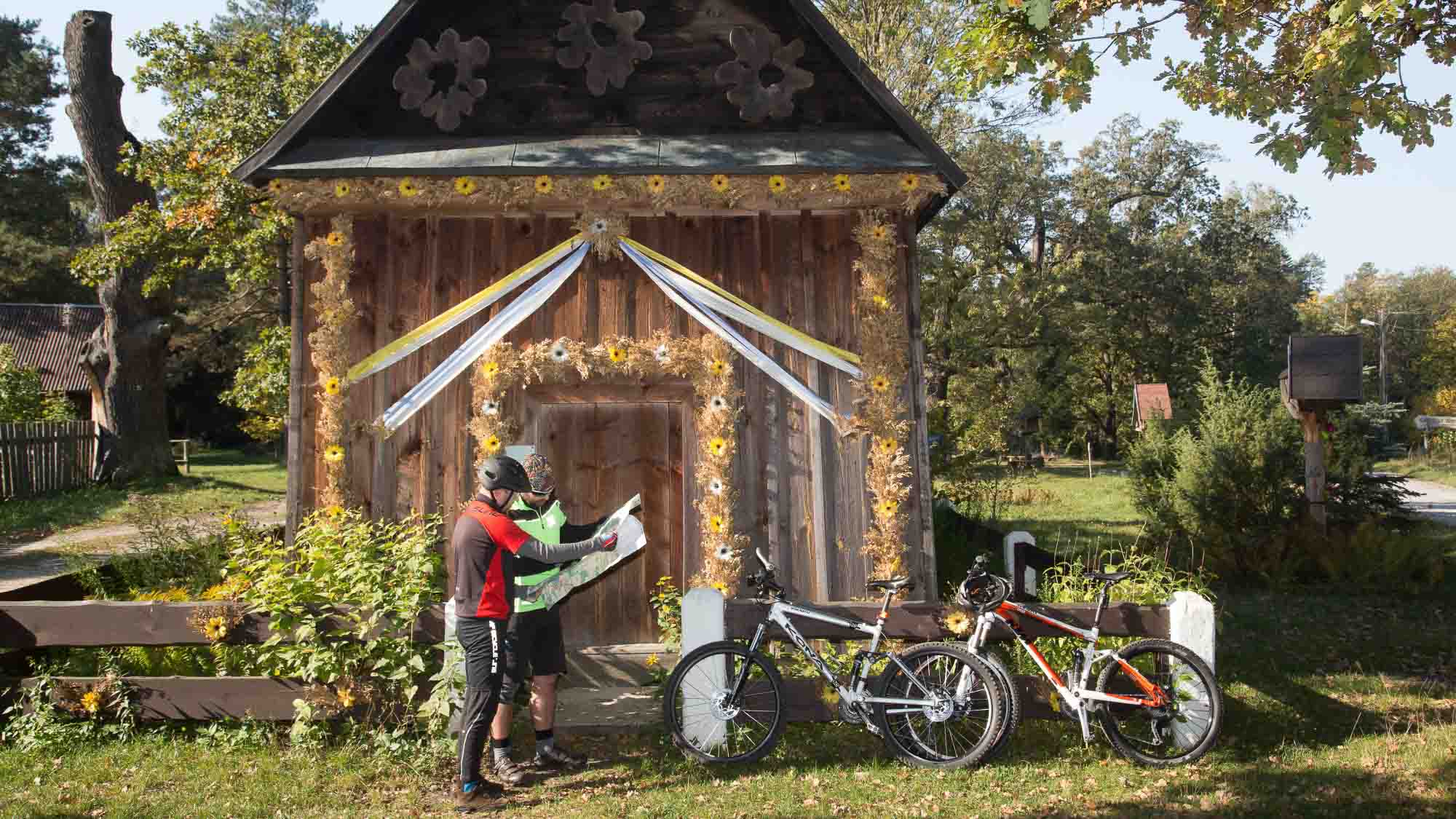 Cyclists by old building in Poland