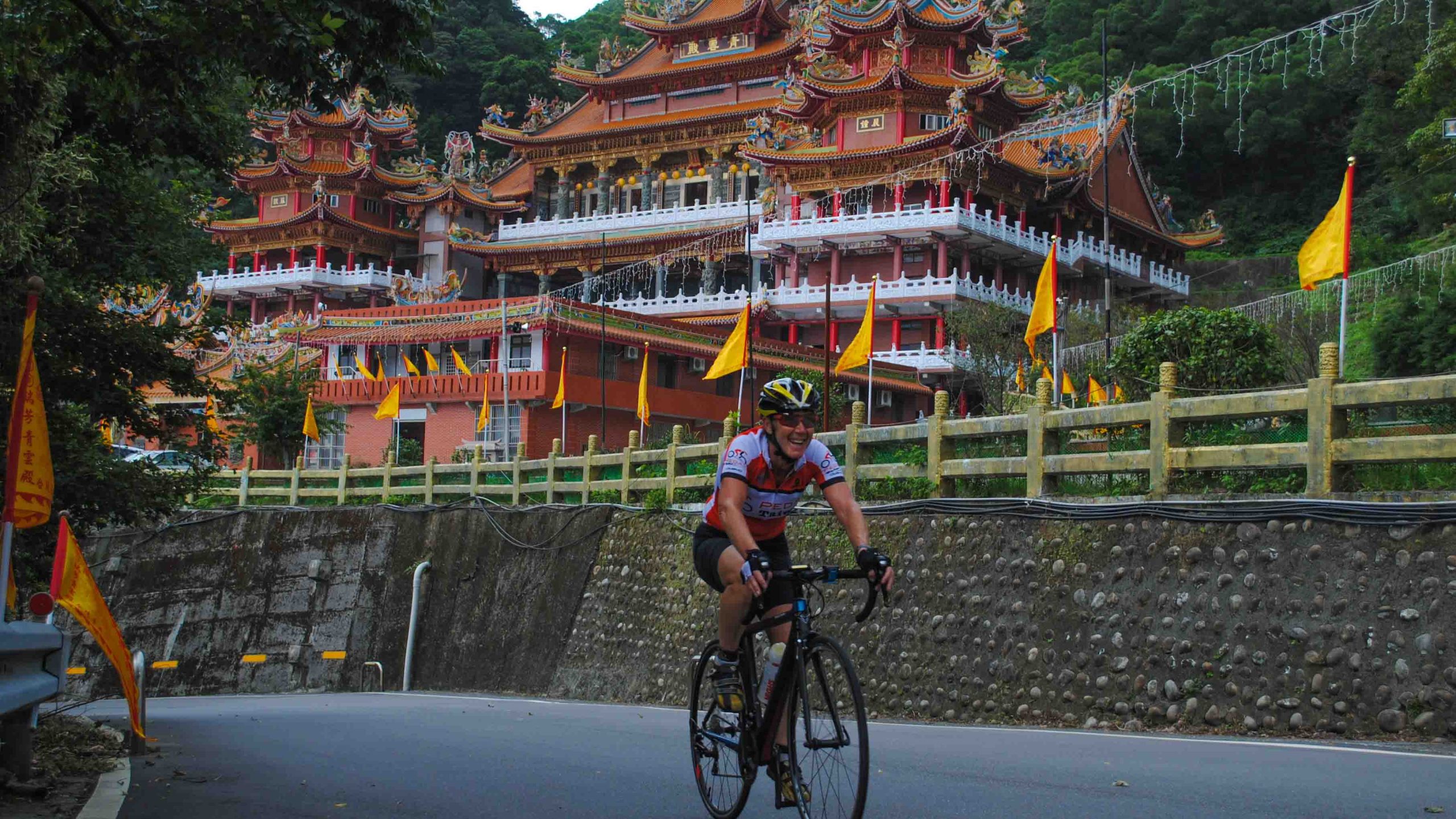 Cycling past a temple in taiwan