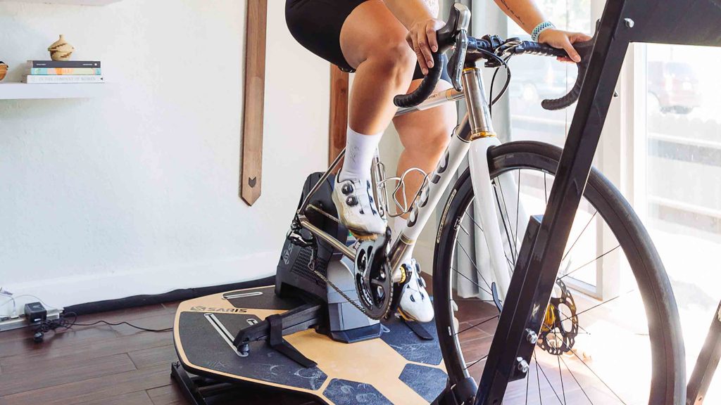 Female cyclist on a Saris turbo trainer hire