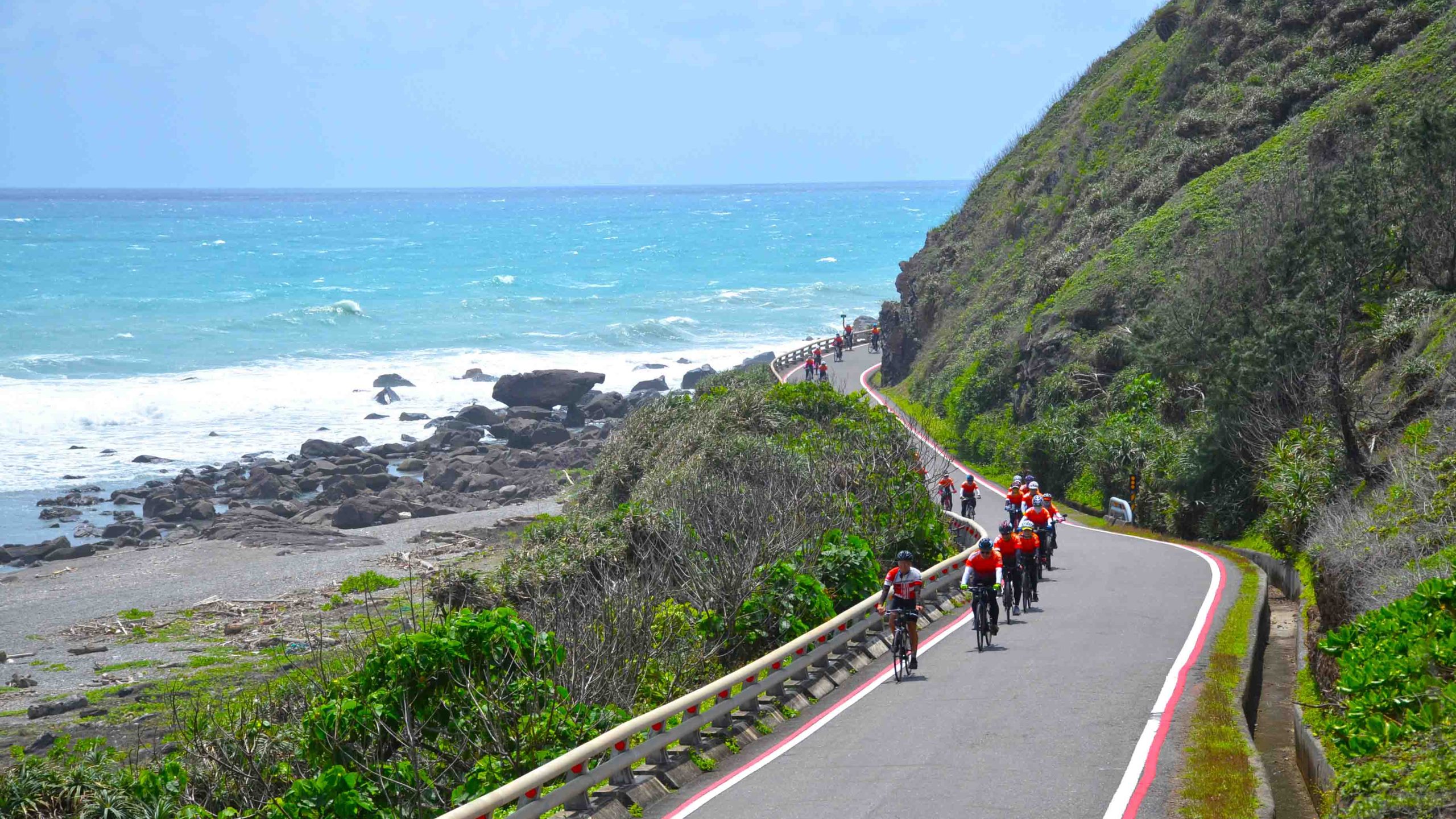 Cyclists cycling along the coast of Taiwan