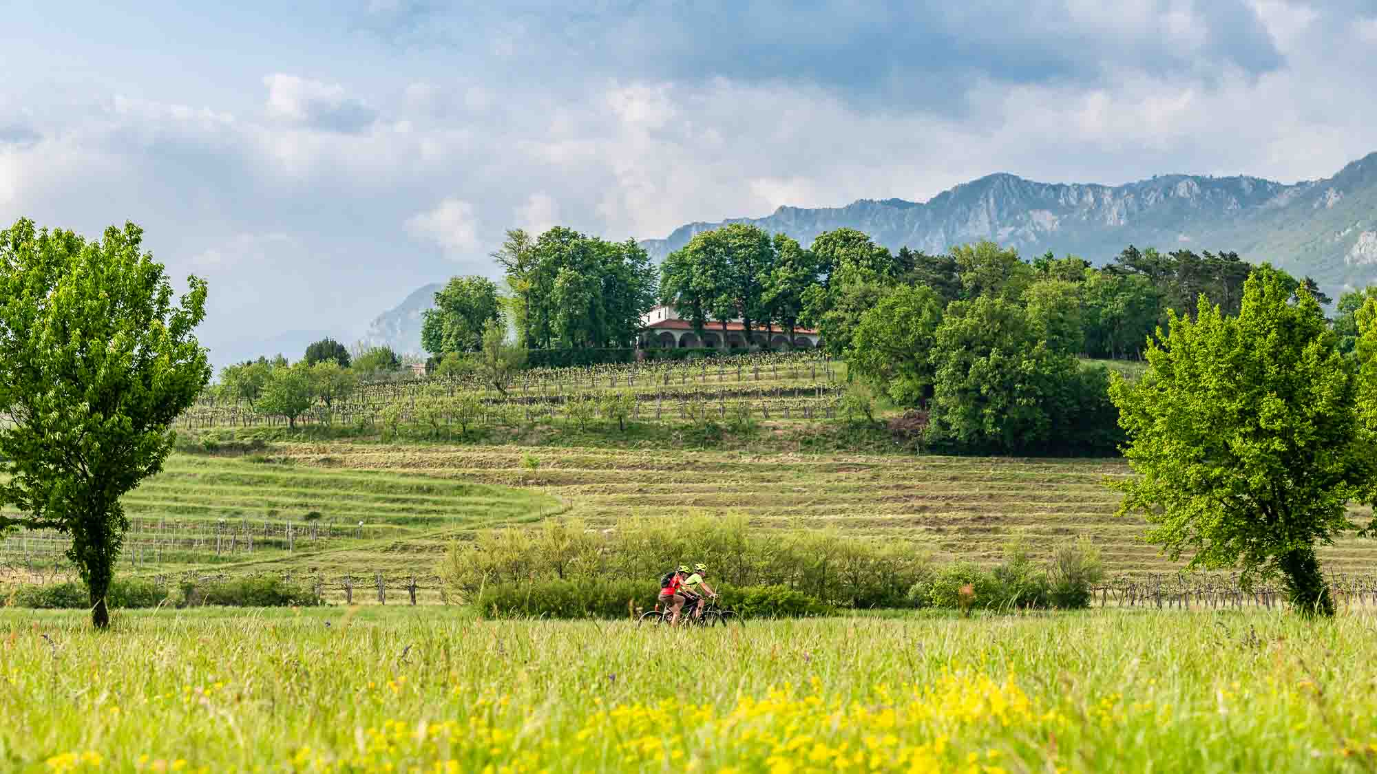 Cyclists near Zemono Manor House, Slovenia