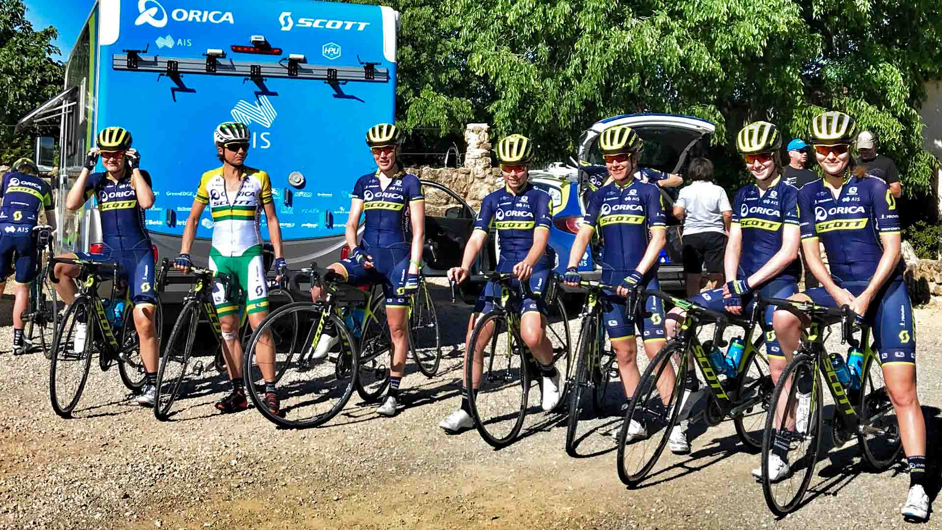 A cyclist team is standing with their bikes in cycling camps Girona