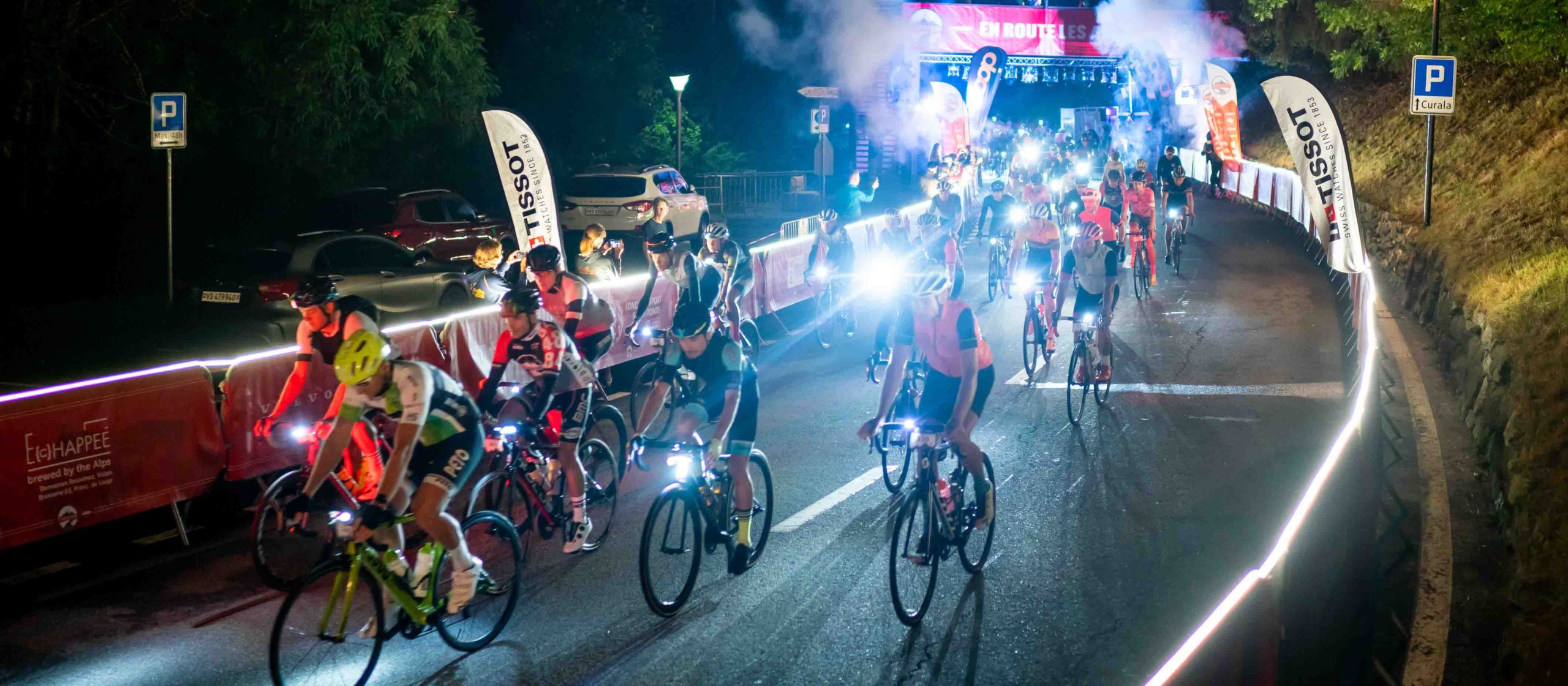 Cyclists in the dark at start of Tour des Stations cycling event in Switzerland
