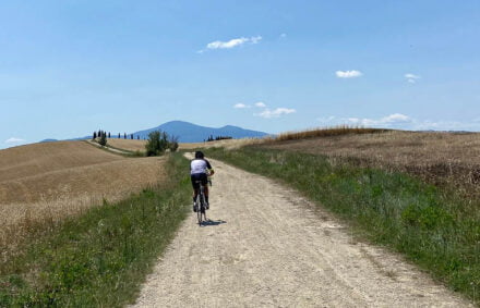 Cyclist on strade bianche cycling tour in Tuscany