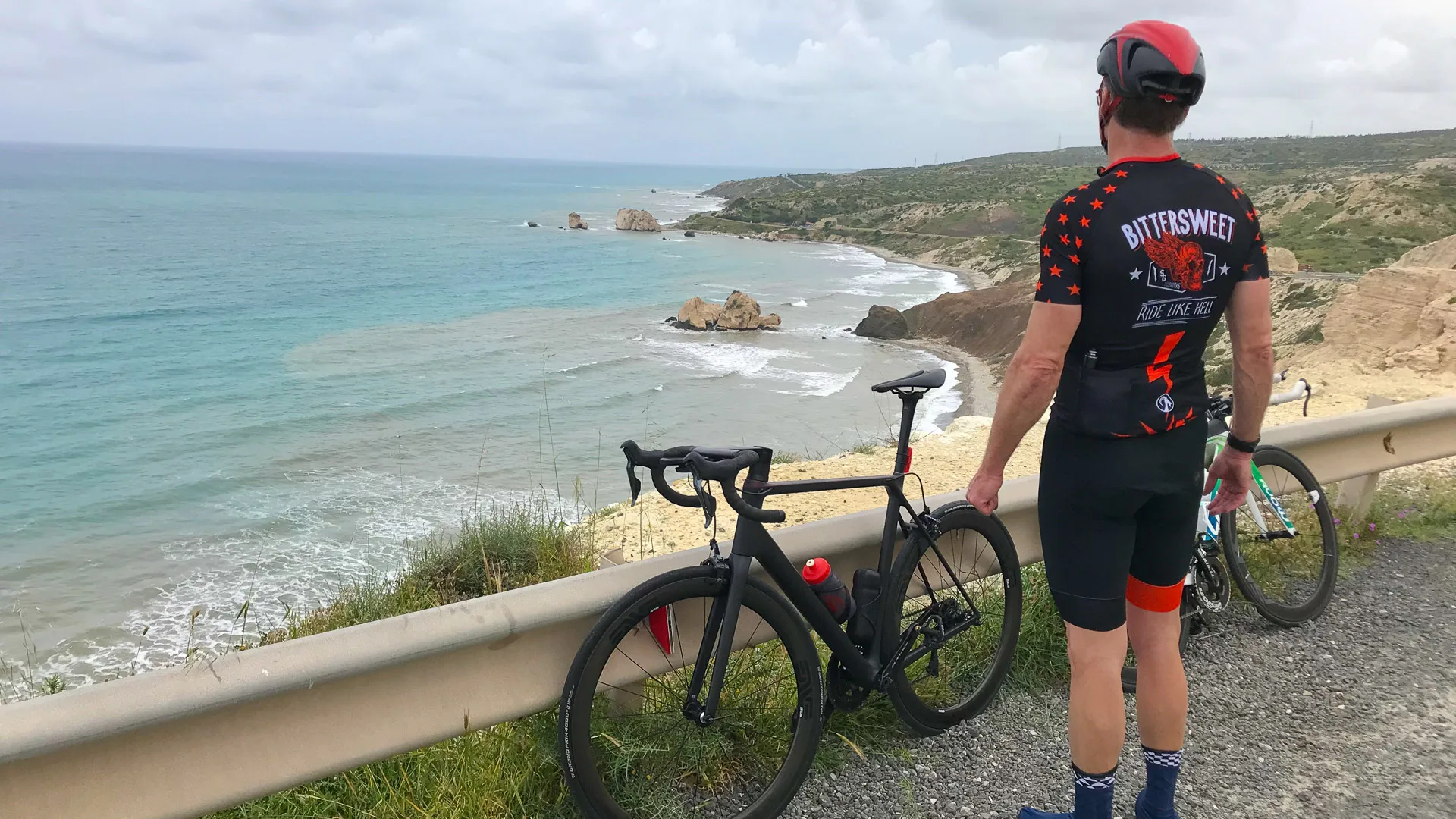 Cyclist looking at Aphrodite's Rock