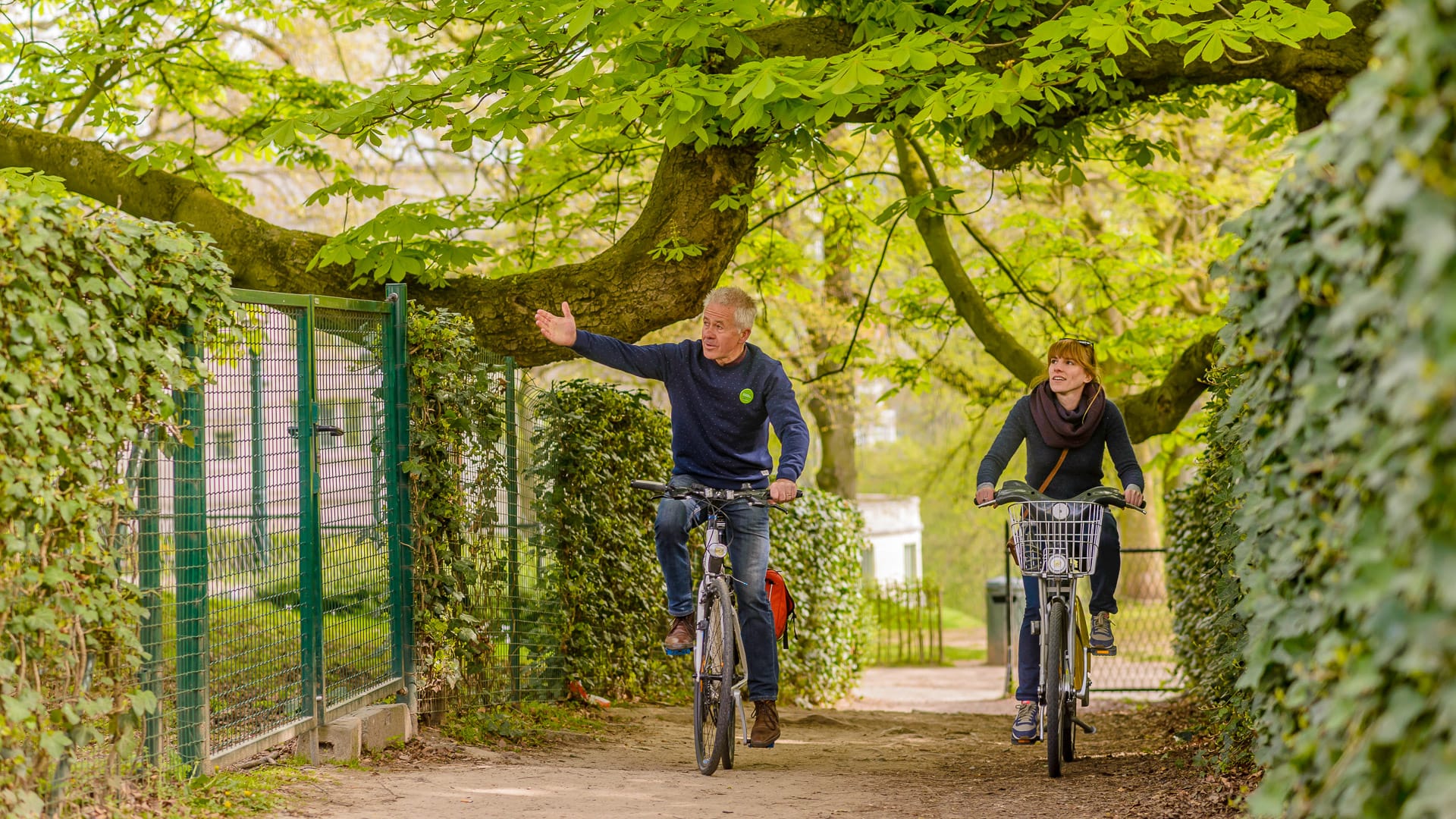 An old man and a girl cycling around brussels