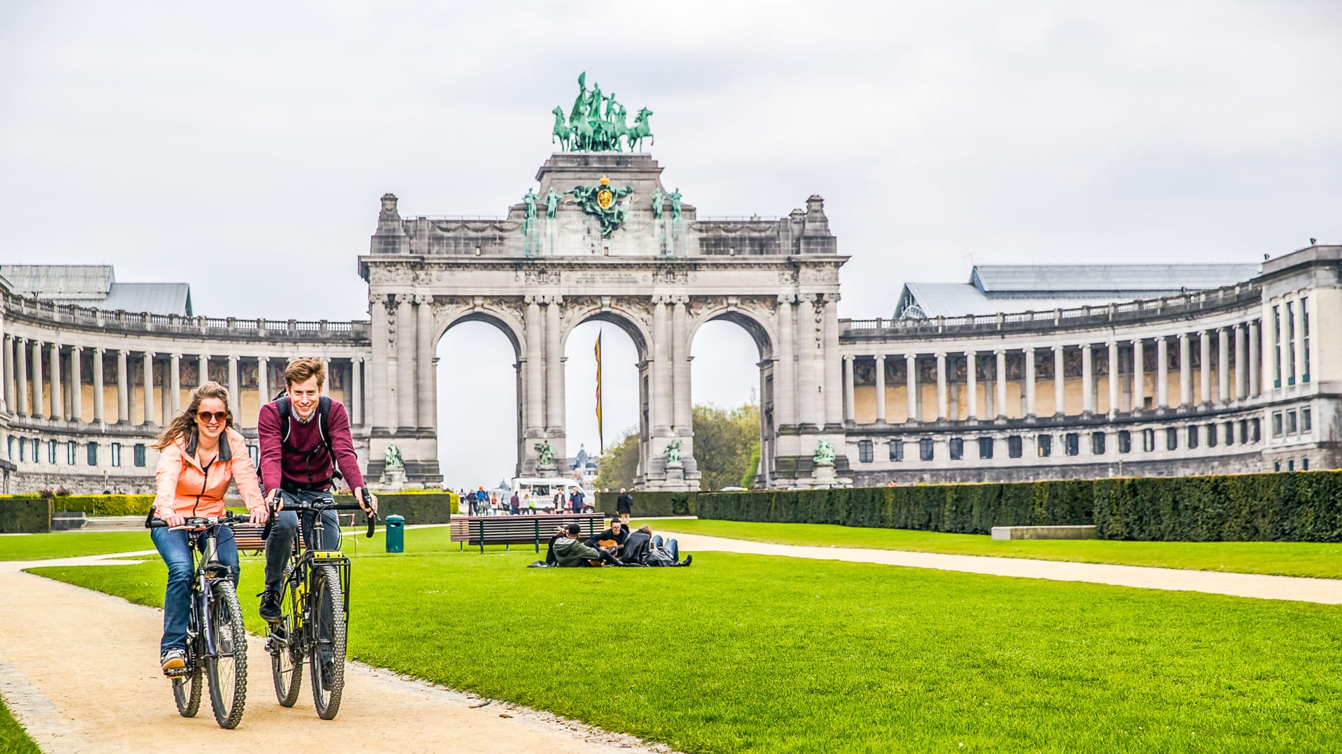 Two cyclists enjoy their cycling in brussels park
