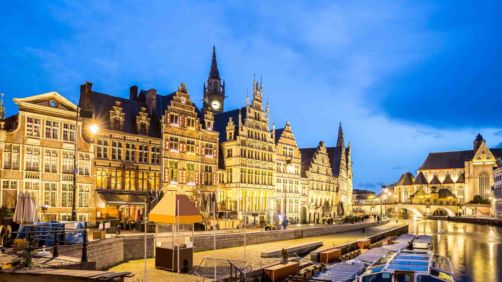 Ghent at dusk with buildings on the waterfront