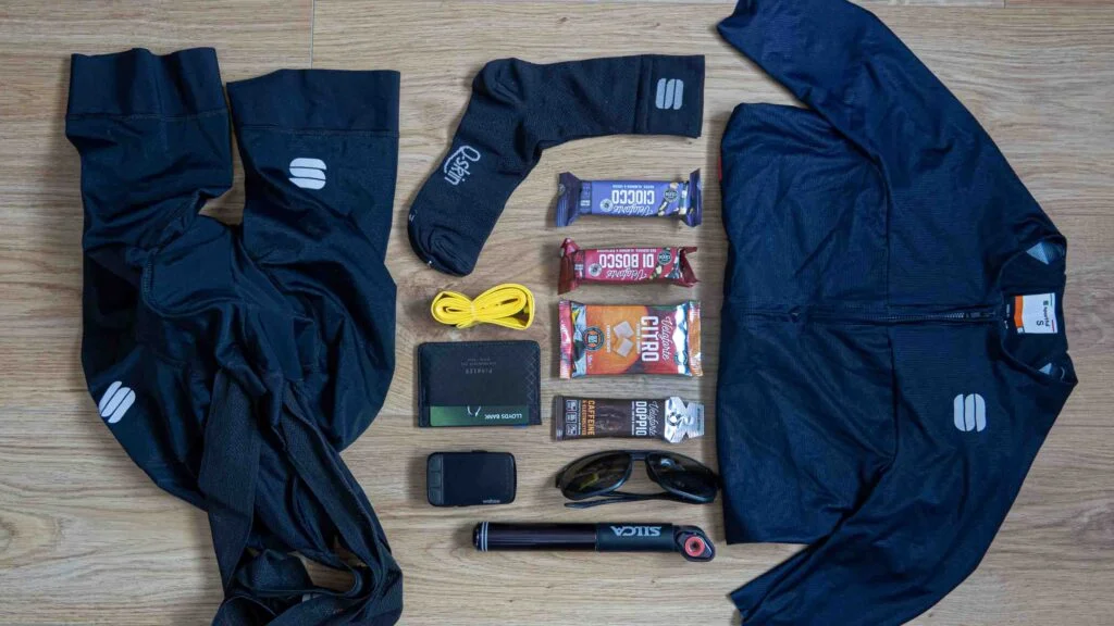 Cycle kit and energy bars and gels laid out ahead of a long endurance ride