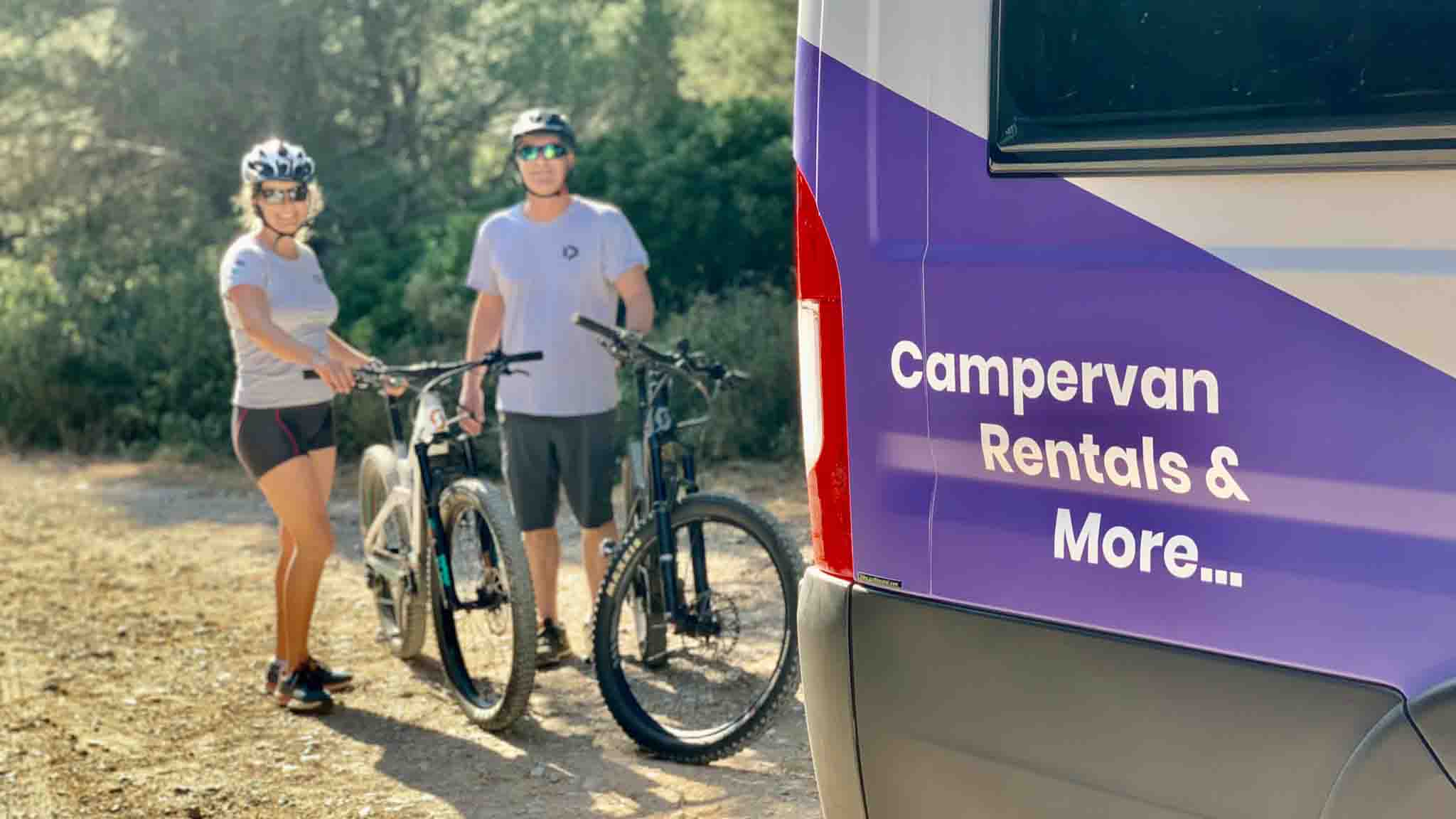Cyclist with camper van cycling accommodation in Costa Brava