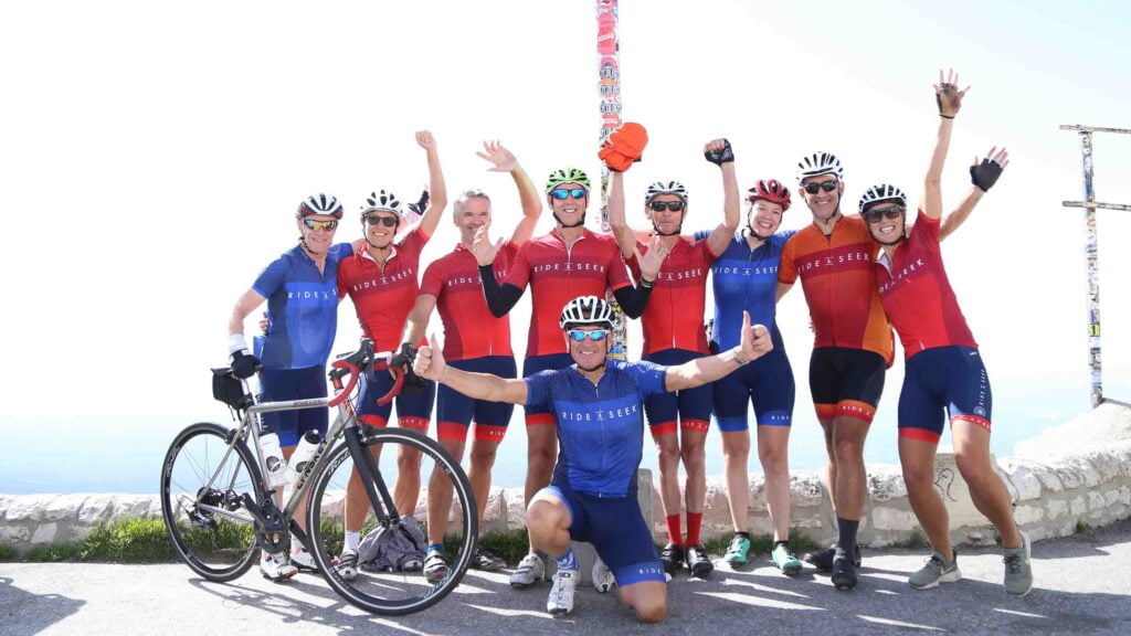 Cyclists celebrating have summitted Mont Ventoux (credit: James Green)