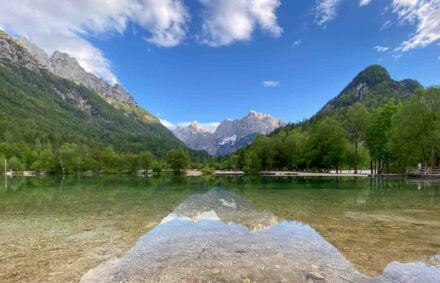 Alpine lake in Slovenia in summer with mountains behind