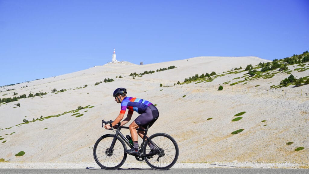 Cyclist with Ventoux summit lunar landscape