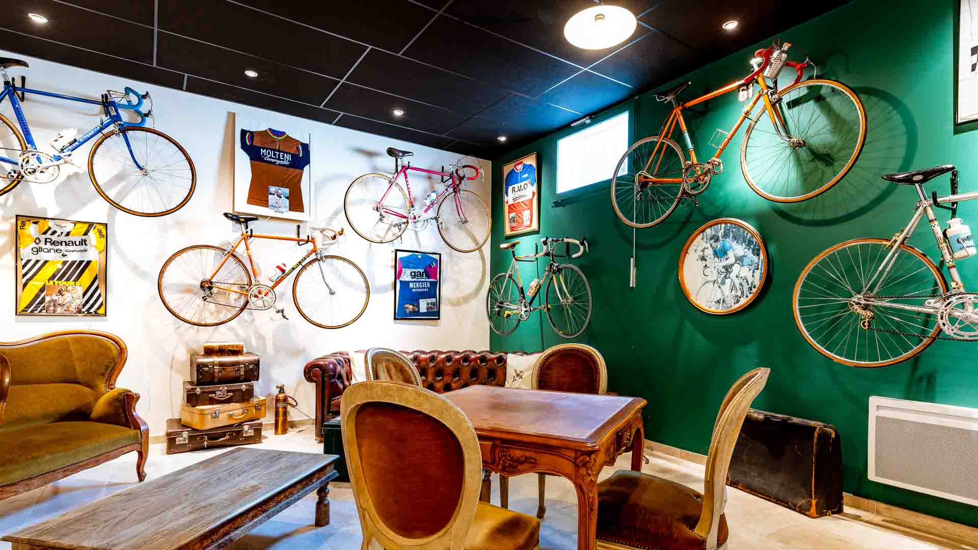 Bicycles hang on the walls at Hotel Le Nesk Ventoux