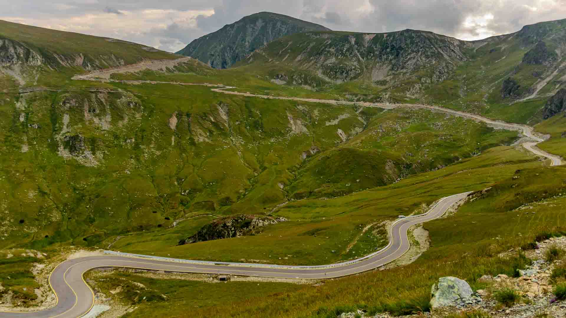 Switchback on way up Transalpina road Romania