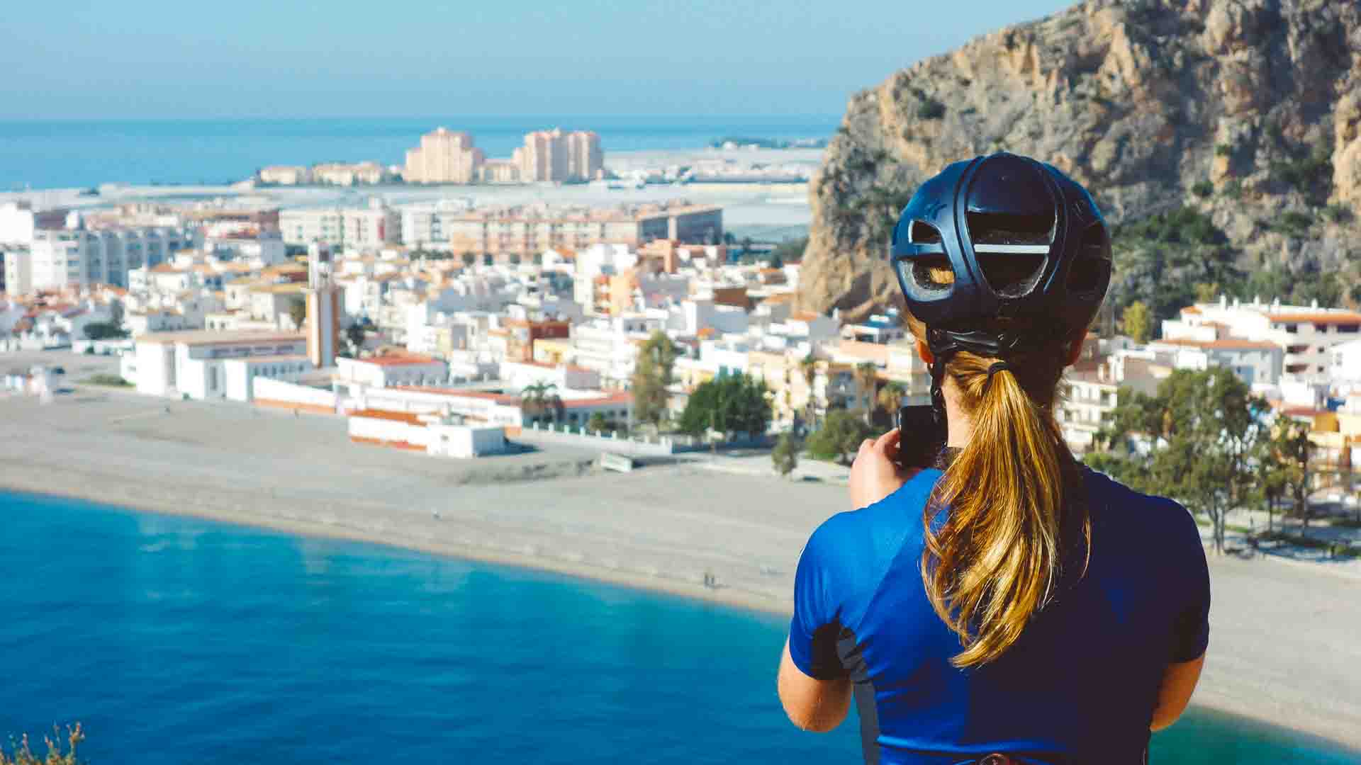 Cyclist photographing Calahonda, Spain