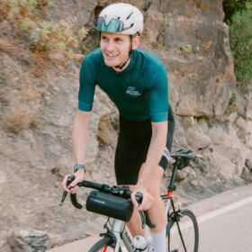 Cyclist in green jersey in Sierra Nevada Spain