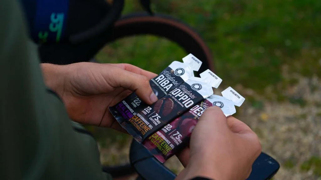 Cyclist with three different Veloforte cycling gels in hands