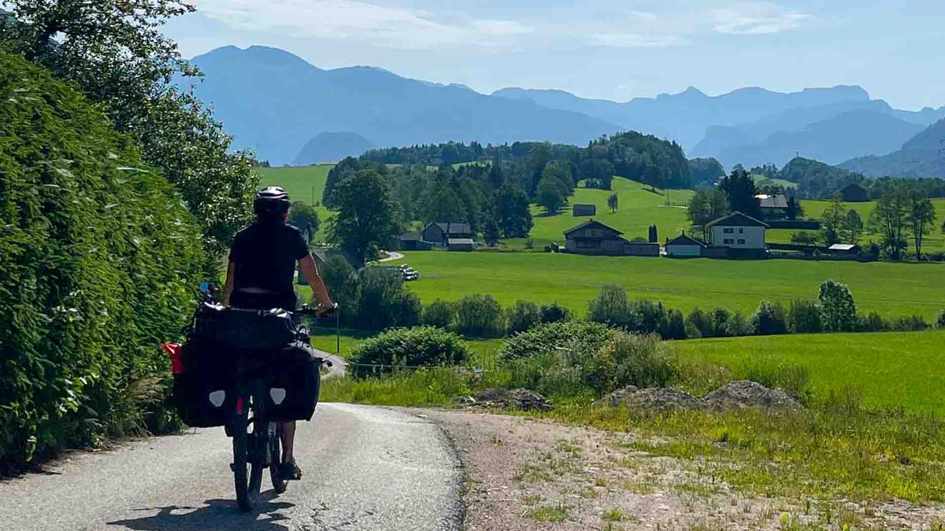 Cyclist on touring bike on road bike tour in Salzakammergut