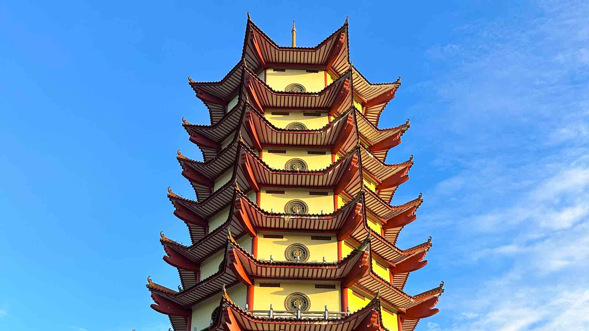Yellow and red temple against a blue sky