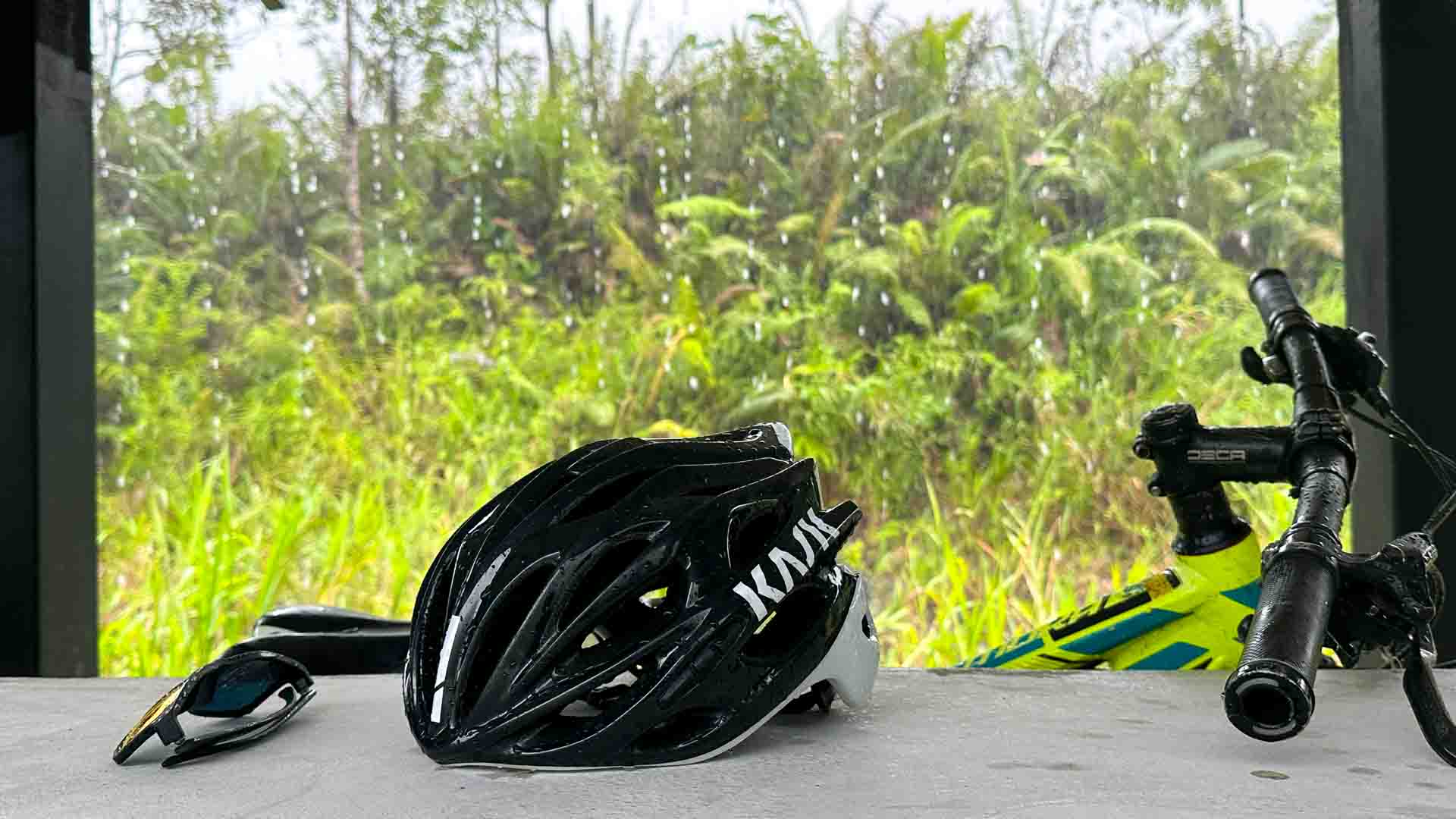 Torrential rain, with helmet and bike in Sarawak Borneo