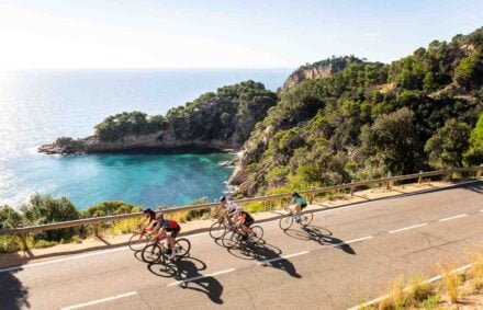 A group of cyclists explore the stunning Costa Brava coastline