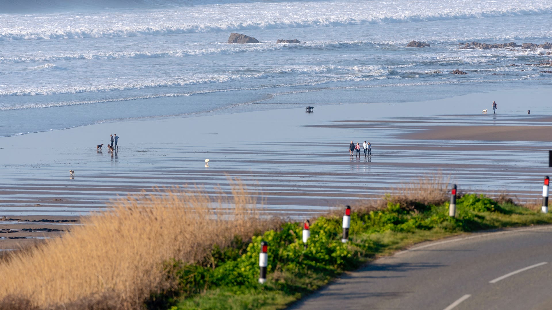 Widemouth Bay, close to Bude, north Cornwall with a backdrop of the sea at low tide.