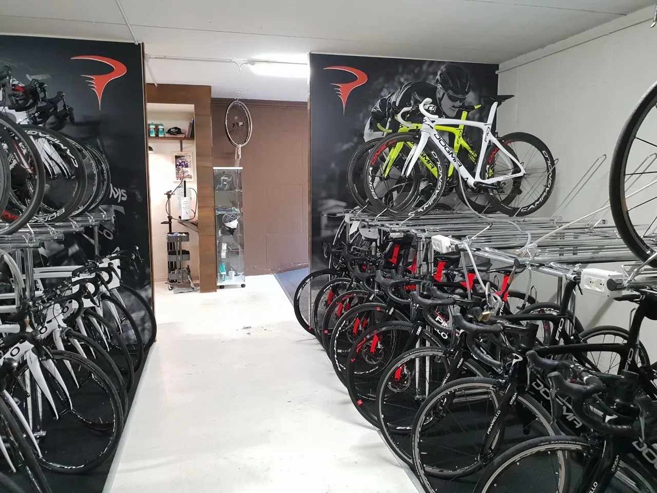 Bike rental area at Lake Garda Bike Hotel with rows of displayed bikes