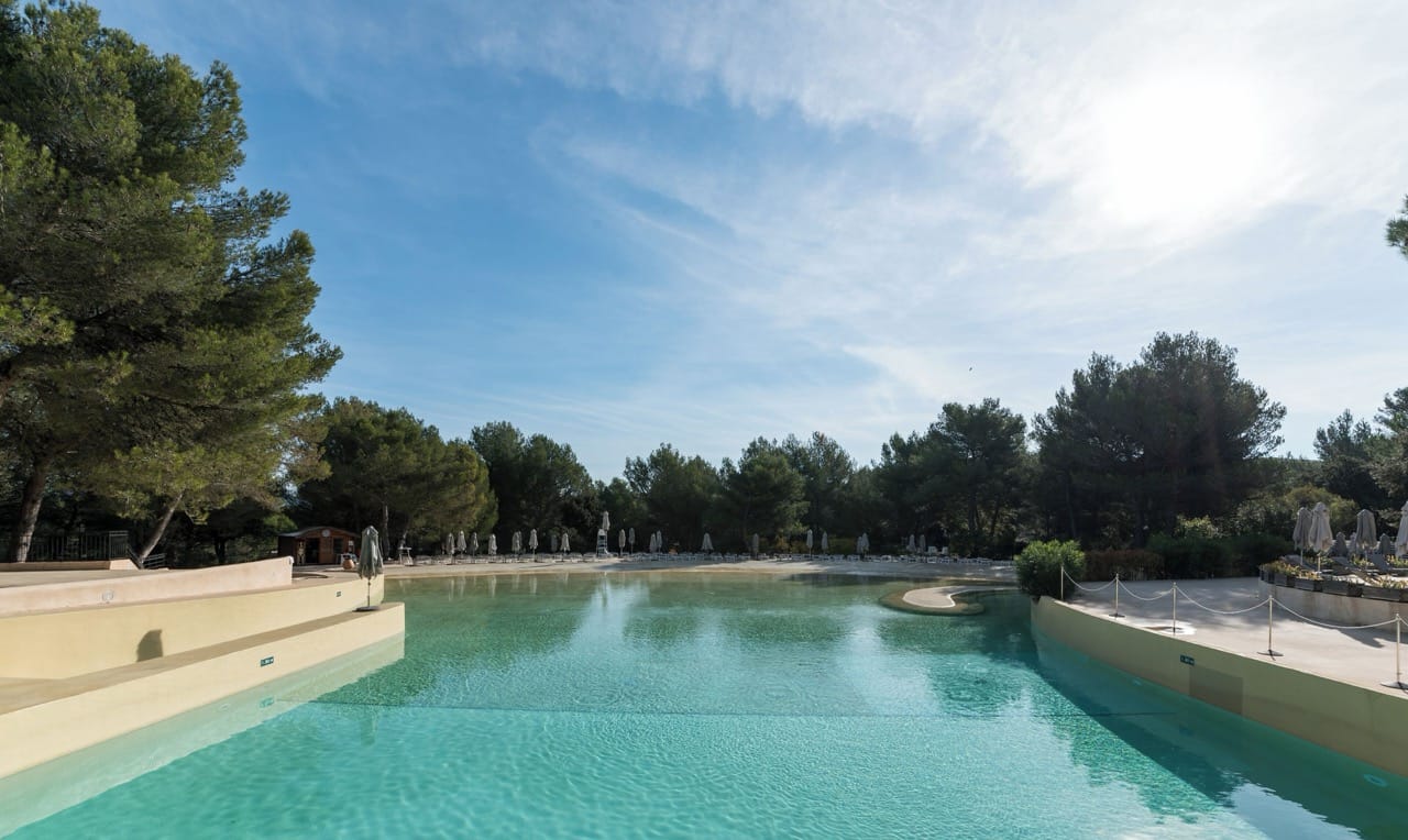 Outdoor pool at Village Pierre & Vacances Pont Royal en Provence, Mallemort surrounded by trees