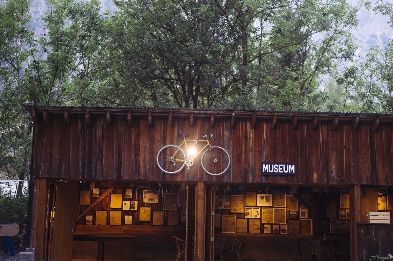 Rustic wooden exterior of a small museum nestled in the mountains near Hotel Au Bon Accueil Les Deux Alpes