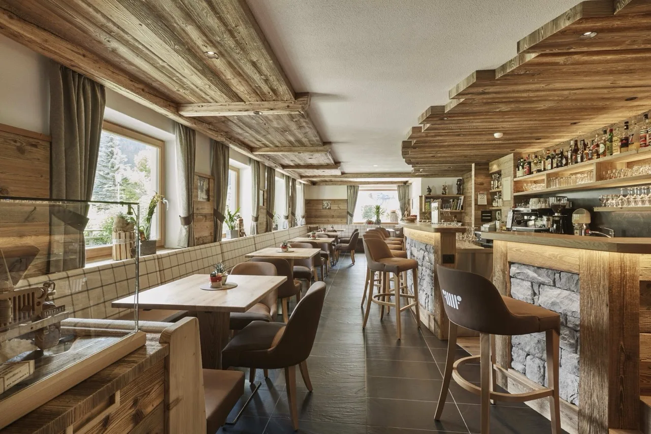 Buffet restaurant at Hotel Rezia in La Villa with warm wooden decor