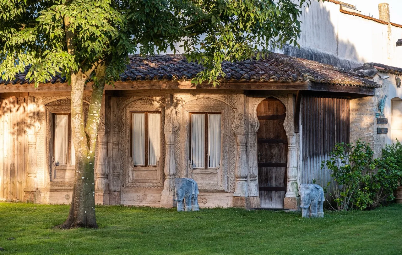 Exterior of La Baronnie Hôtel & Spa Teritoria Saint-Martin-de-Ré showing traditional stone building and surrounding greenery
