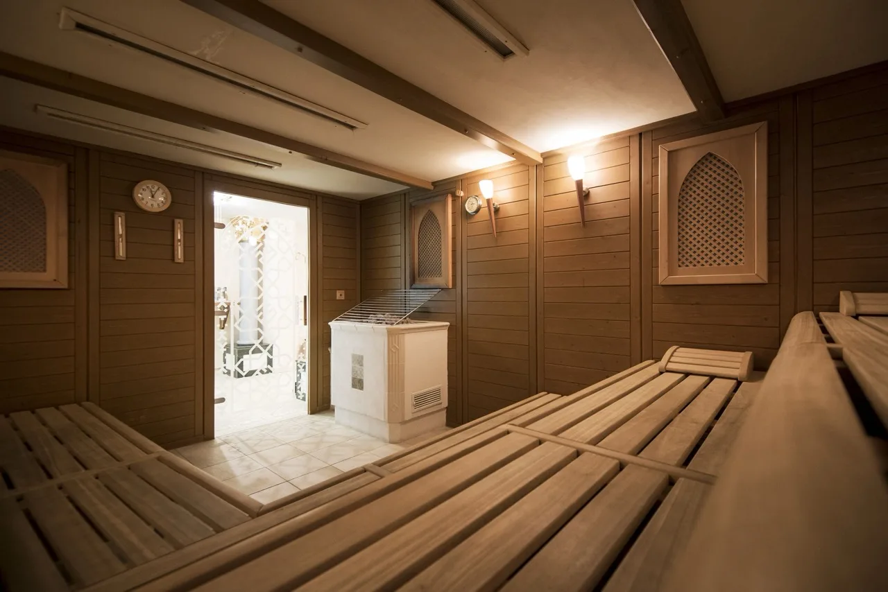 Sauna at Hotel Cappella with wooden benches and walls in warm alpine style
