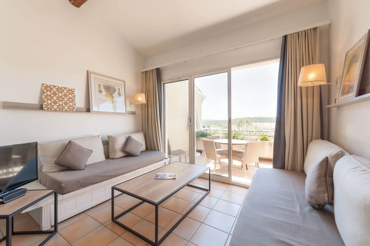 Living room at Village Pierre & Vacances Pont Royal en Provence, Mallemort with balcony and natural light
