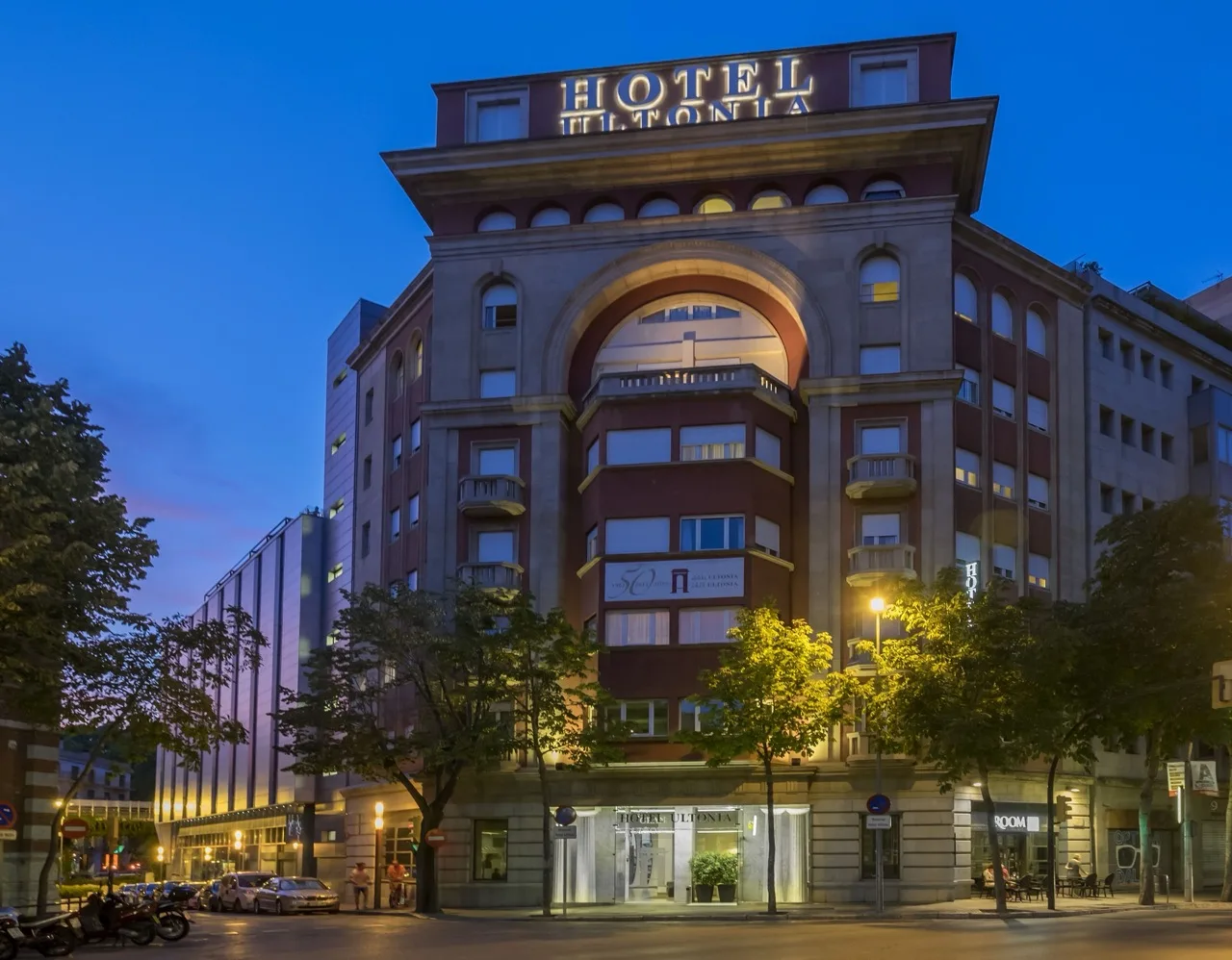 Exterior of Hotel Ultonia in Girona with modern facade and street view