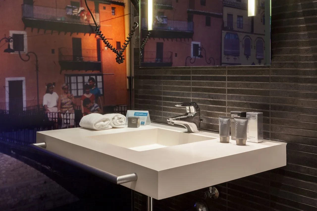 Large white sink and mirror at Hotel Palau de Bellavista Girona