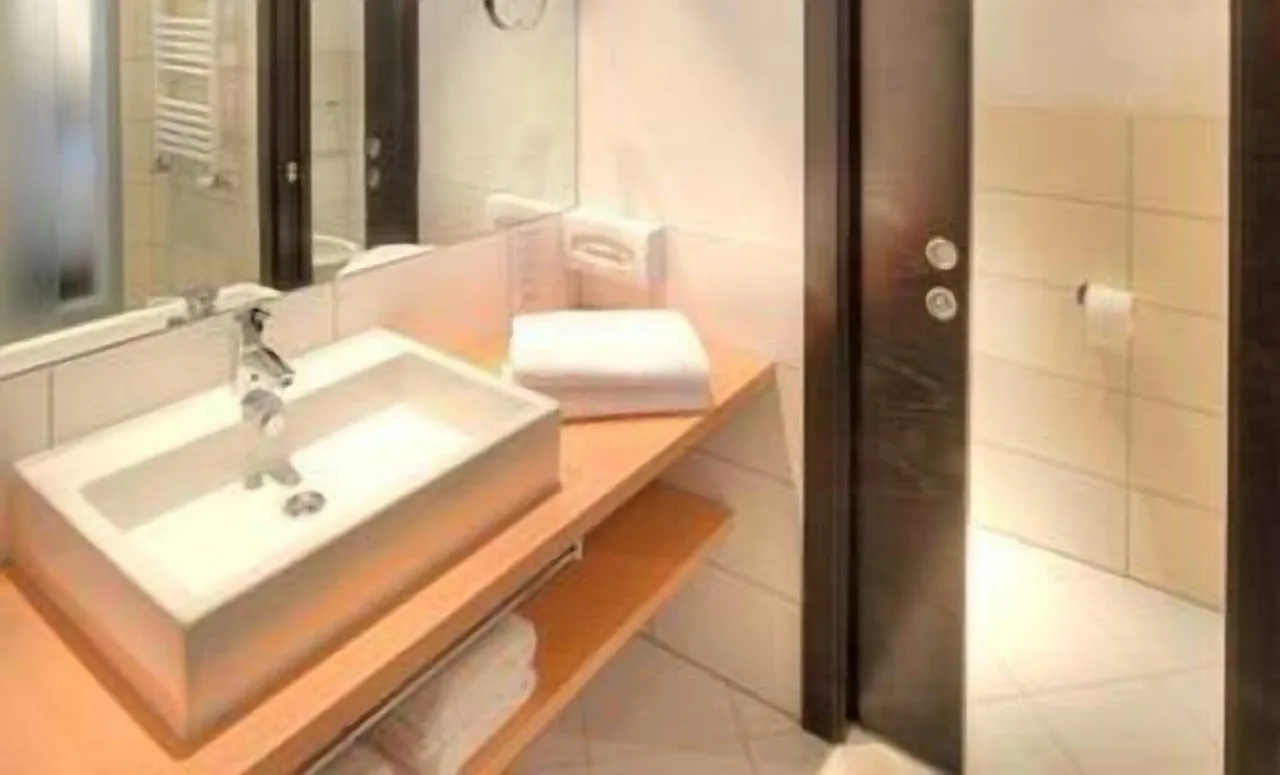 Washroom at Hotel Rezia in La Villa with modern fixtures and clean design
