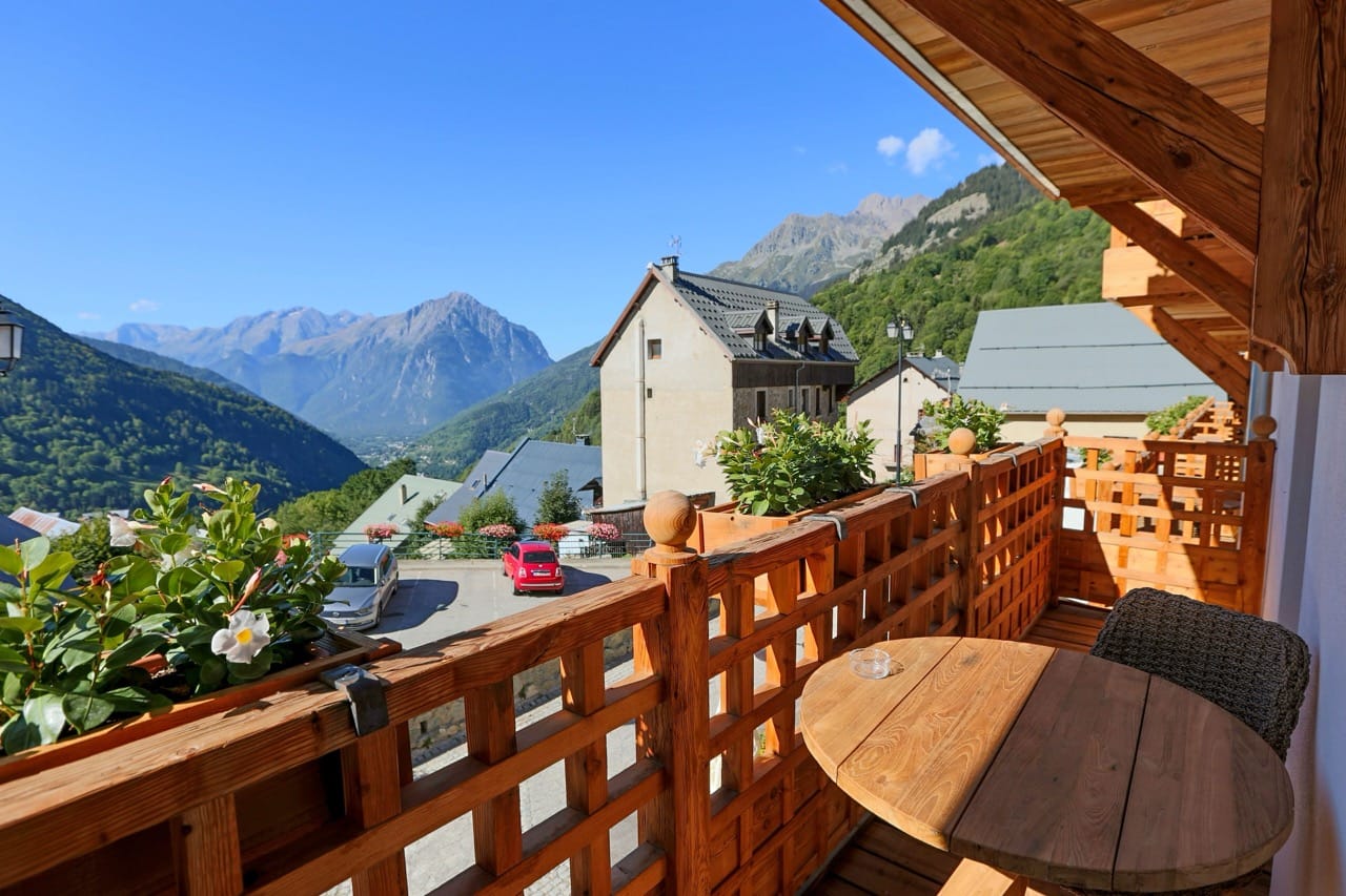 View from balcony at Hotel Le V de Vaujany in Vaujany showing mountains and valley scenery