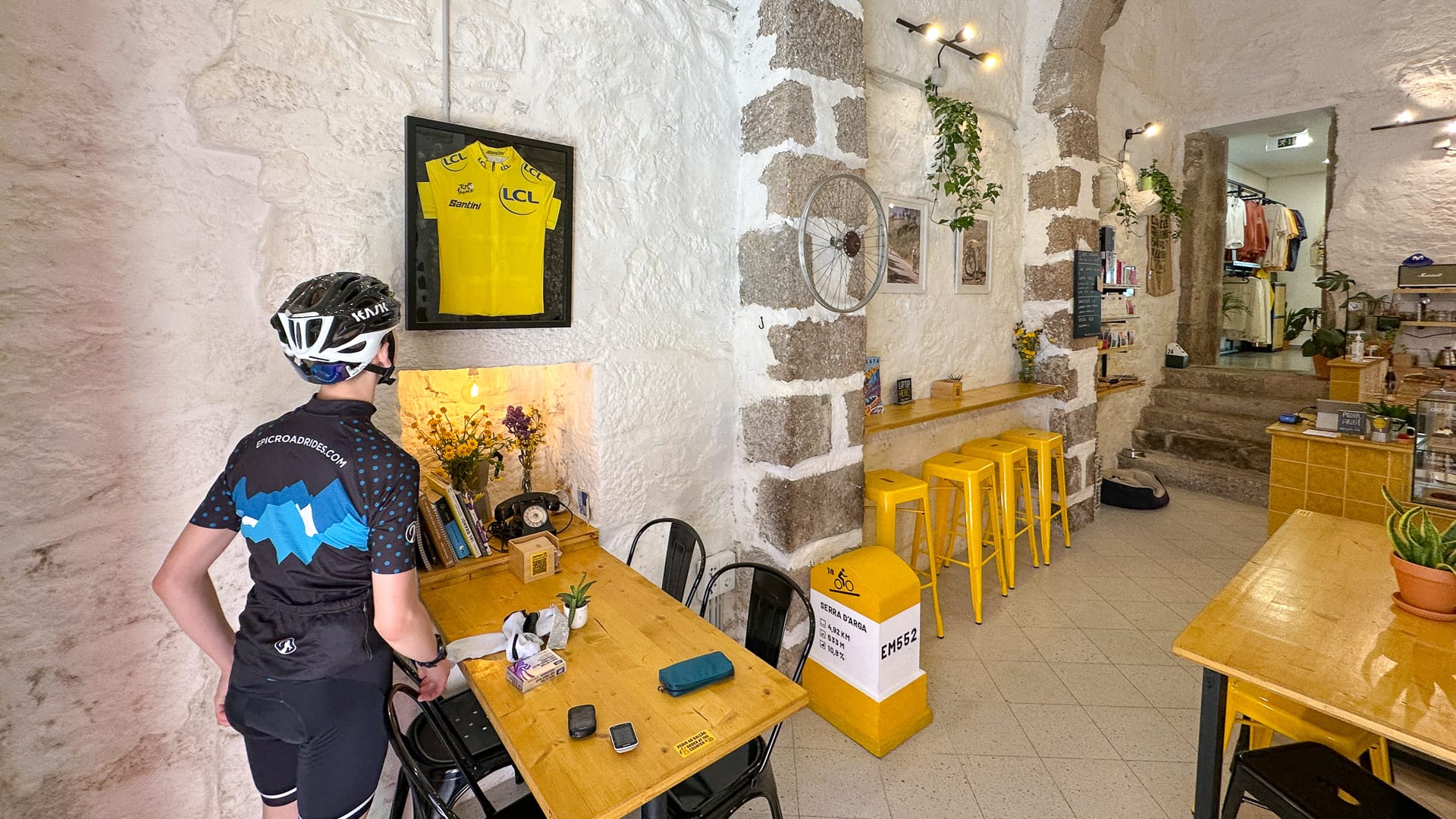 Cyclist stopping by a cycling-themed café